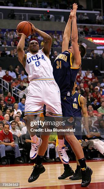 Russell Westbrook of the UCLA Bruins shoots over the defense of Ryan Anderson of the California Golden Bears during the first half of the...