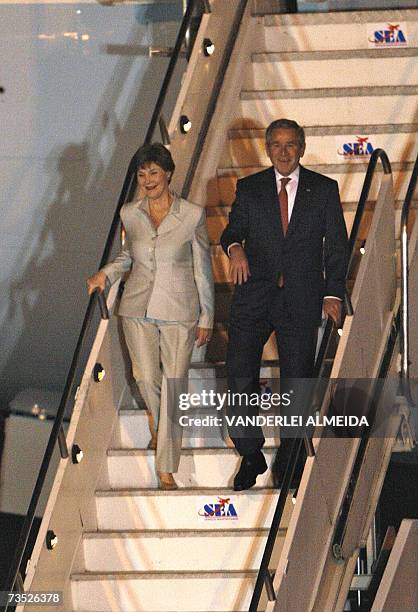 President George W. Bush and First Lady Laura step off Air Force One upon arrival 08 March 2007 at Guarulhos International Airport in Sao Paulo,...