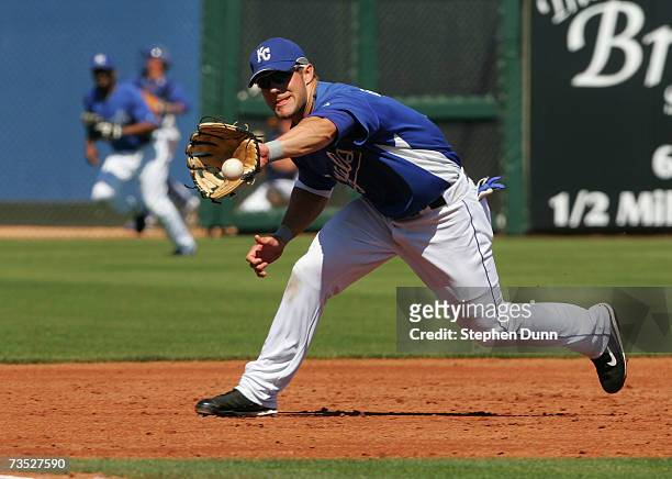 Third baseman Alex Gordon of the Kansas City Royals fields a ball against the Seattle Mariners during Spring Training on March 8, 2007 at Surprise...