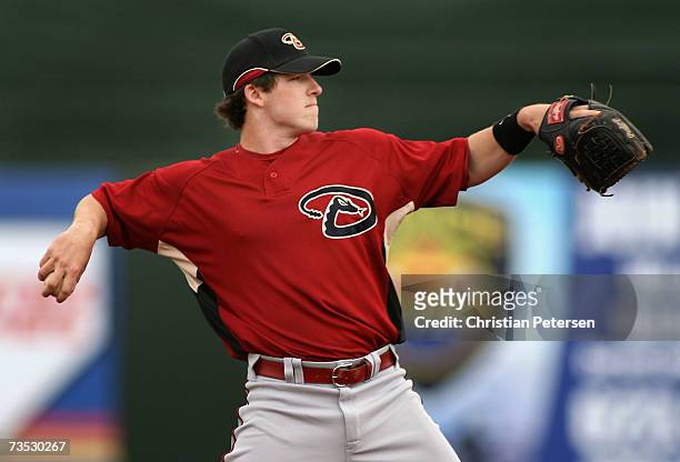 Infielder Stephen Drew of the Arizona Diamondbacks warms up inbetween innings of the MLB spring training game against the Texas Rangers at Surprise...