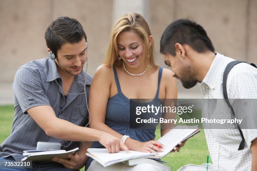 Three students studying outdoors Three students studying outdoors
