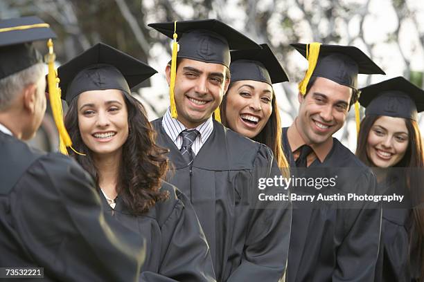 graduate students standing in a row, outdoors - dean stock pictures, royalty-free photos & images