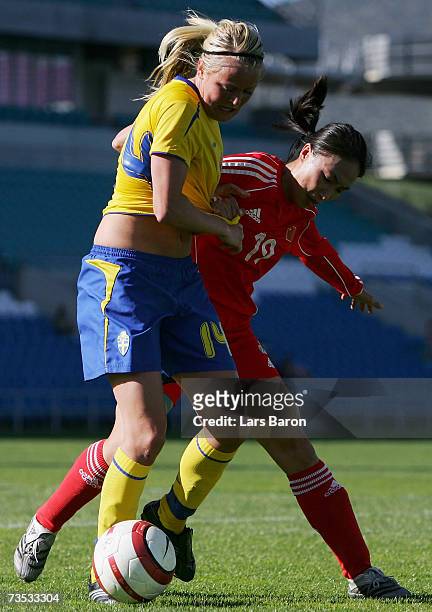 Josefine Oeqvist of Sweden in action with Qu Feifei of China during the Algarve Cup match between Sweden and China on March 9, 2007 in Faro, Portugal.
