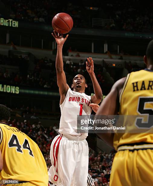 Mike Conley Jr. #1 of the Ohio State Buckeyes drives for a shot attempt against the Michigan Wolverines during the quarterfinals of the Big Ten Men's...