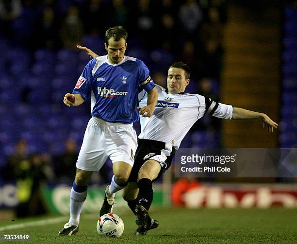 Stephen Clemence of Birmingham City gets tackled by Matt Oakley of Derby County during the Coca-Cola Championship match between Birmingham City and...