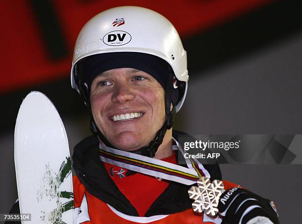 Nathan Roberts celebrates on the podium of the Men's Moguls race of the Freestyle World Championship in Madonna di Campiglio 09 March 2007. Canadian...