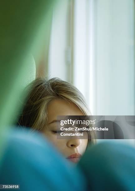 woman sitting with knees up, partial view - self reflection stock pictures, royalty-free photos & images