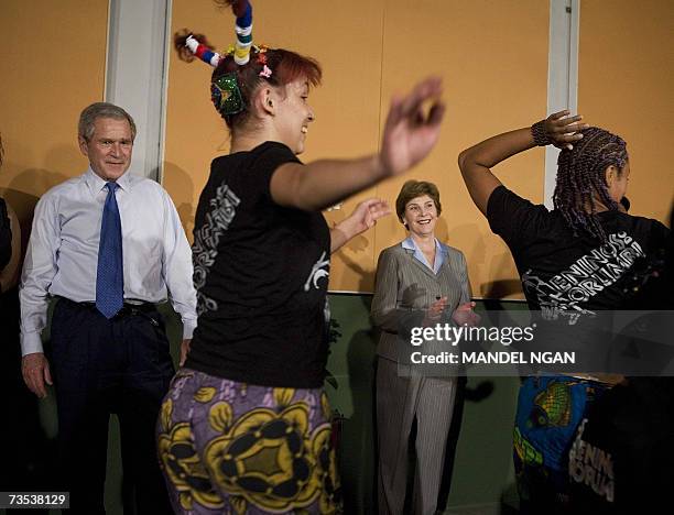 President George W. Bush and First Lady Laura Bush watch dancers performan during a visit to ?Meninos do Murumbi? 09 March 2007 in Sao Paulo, Brazil....