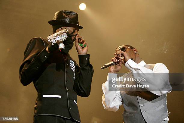 Recording artists Snopp Dogg and P. Diddy smoke on stage at the Hartwall Areena, on March 9, 2007 in Helsinki, Finland. This concert marks the...