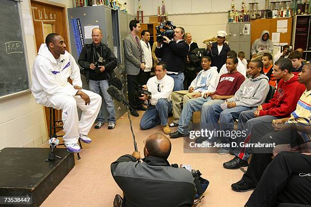 Kobe Bryant of the Los Angeles Lakers talks to a classroom of students while visiting his alma mater, Lower Merion High School March 9, 2007 in...