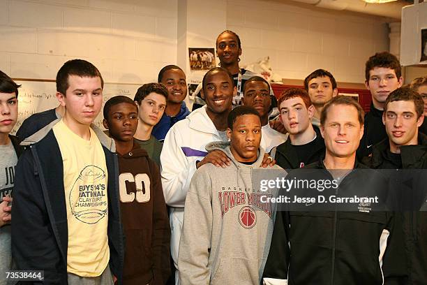 Kobe Bryant of the Los Angeles Lakers poses with students while visiting his alma mater, Lower Merion High School March 9, 2007 in Philadelphia,...