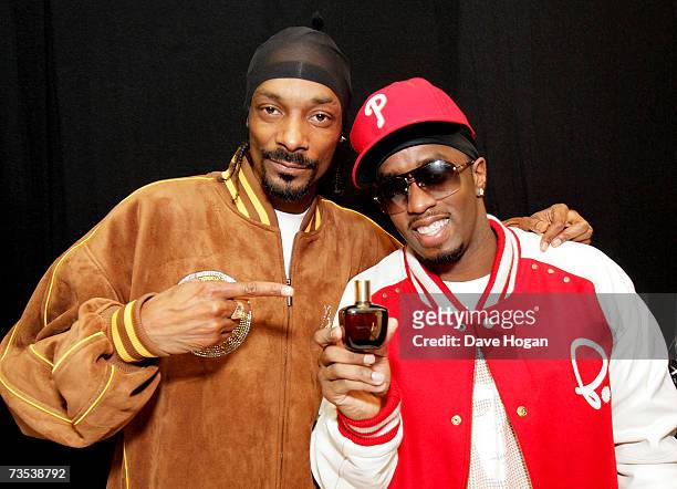 Snoop Dogg sprays P. Diddy with his perfume 'Unforgivable' while they pose backstage at the Hartwall Areena, on March 9, 2007 in Helsinki, Finland....