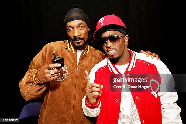 Snoop Dogg sprays P. Diddy with his perfume 'Unforgivable' while they pose backstage at the Hartwall Areena, on March 9, 2007 in Helsinki, Finland....