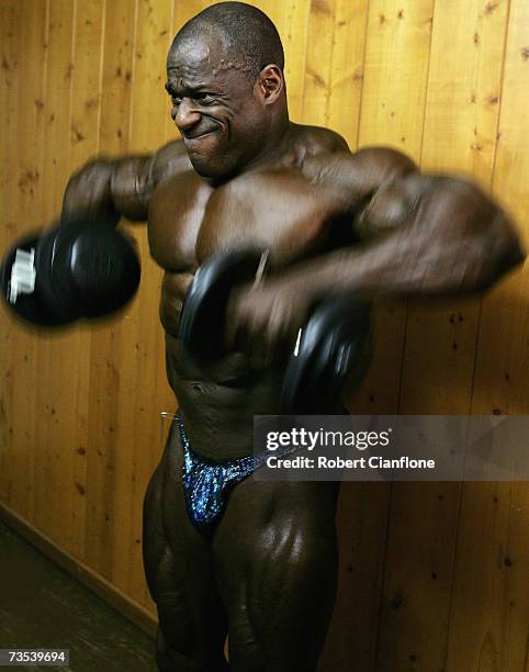 Vince Taylor of the USA pumps up backstage prior to the 2007 IFBB Australian Bodybuilding Grand Prix VII at Dallas Brooks Hall on March 10, 2007 in...