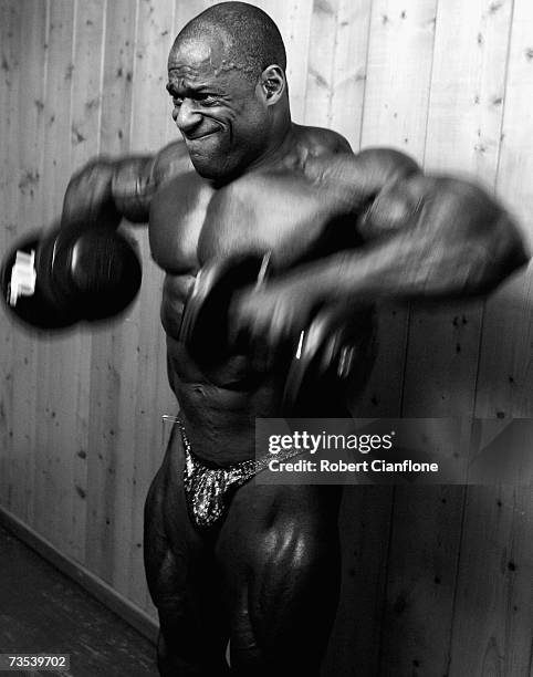 Vince Taylor of the USA pumps up backstage prior to the 2007 IFBB Australian Bodybuilding Grand Prix VII at Dallas Brooks Hall on March 10, 2007 in...