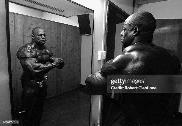 Vince Taylor of the USA checks his pose backstage prior to the 2007 IFBB Australian Bodybuilding Grand Prix VII at Dallas Brooks Hall on March 10,...