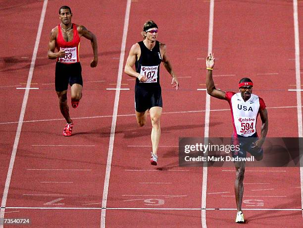 LaBronze Garrett of the USA wins the Mens 400 Metres Hurdles Open from Brendan Cole of the ACT during day two of the Australian Athletics...