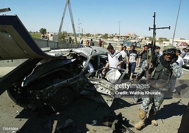 Iraqi soldiers secure the scene of a car bomb explosion on March 10, 2007 near Sadr city Shiite neighborhood in Baghdad, Iraq. As delegates from Iraq...