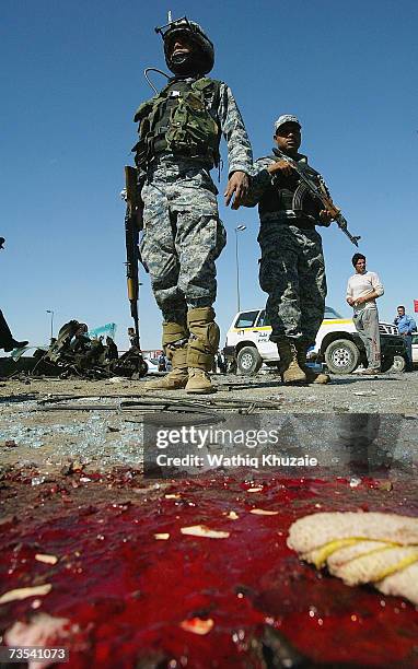 Blood is seen as Iraqi soldiers secure the scene of a car bomb explosion on March 10, 2007 near Sadr city Shiite neighborhood in Baghdad, Iraq. As...