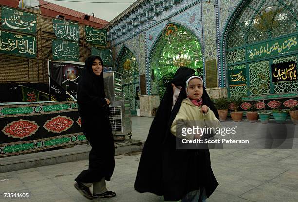 Girls walk past the shrine of Zaid ibn Ali, as Iranian Shiite Muslims mark Arbaeen, the 40th day after the death of Imam Hussein in 680 AD, in the...