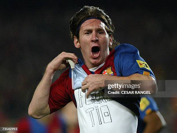 Barcelona's Leo Messi celebrates after scoring his second goal against Real Madrid during a Spanish league football match at the Camp Nou stadium in...