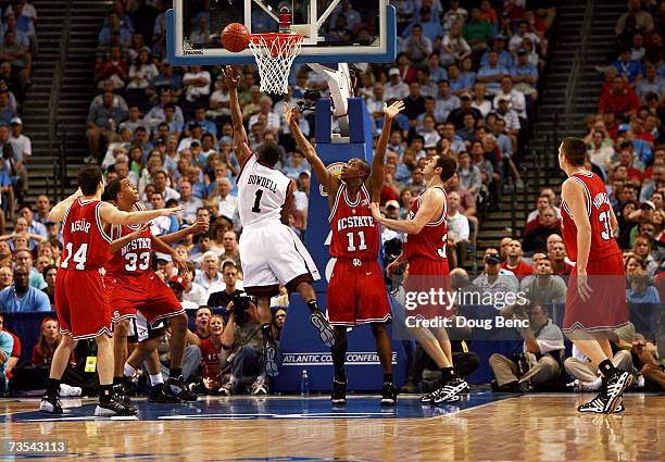 Zabian Dowdell of the Virginia Tech Hokies scores with less than two seconds to go in the first half against the North Carolina State Wolfpack in the...