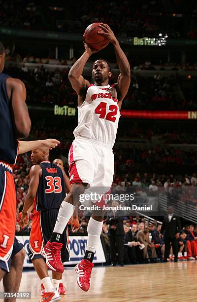 Alando Tucker of the Wisconsin Badgers attempts a shot against the Illinois Fighting Illini during the semifinals of the Big Ten Men's Basketball...