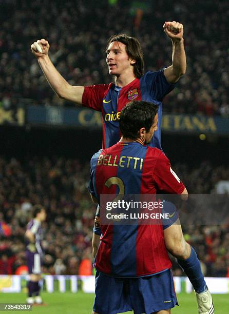 Barcelona's Argentinian Leo Messi celebrates after scoring his third goal against Real Madrid during a Spanish league football match at the Camp Nou...