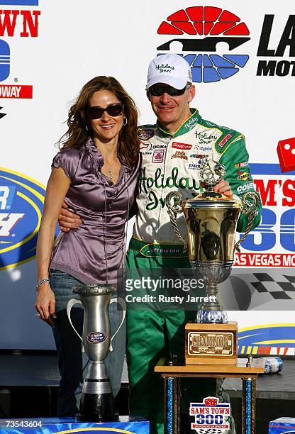Jeff Burton, driver of the Holiday Inn Chevrolet , stands with his wife Kim, in victory lane, following the NASCAR Busch Series Sam's Town 300 at Las...