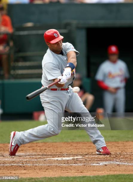 Albert Pujols of the St.Louis Cardinals hits against the Baltimore Orioles during a Spring Training game at the Fort Lauderdale Stadium on March 10,...