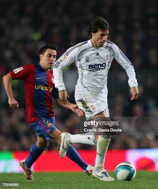 Ruud van Nistelrooy of Real Madrid is chased by Xavi of Barcelona during the Primera Liga match between Barcelona and Real Madrid at the Nou Camp...