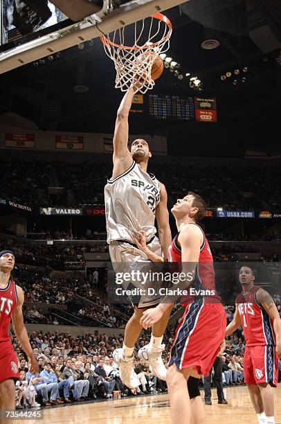 Tim Duncan of the San Antonio Spurs shoots against Jason Collins of the New Jersey Nets during the game at the AT&T Center on March 10, 2007 in San...