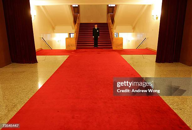 Plainclothes soldier stands guard at the Great Hall of the People during the third plenary session of the National People's Congress, or parliament,...