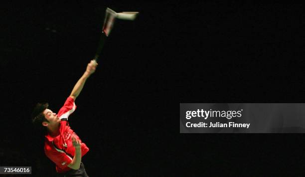 Lin Dan of China plays a smash in his match against Chen Yu of China in the Men's Singles final during the Yonex All England Open Badminton...