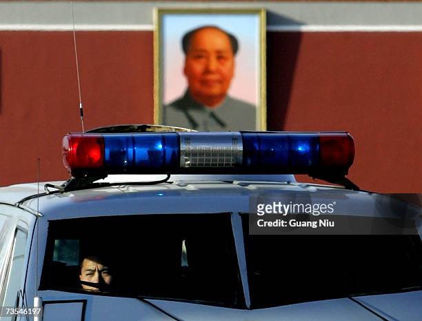 Chinese policeman guards outside the Great Hall of the People during the third plenary session of the National People's Congress, or parliament, on...