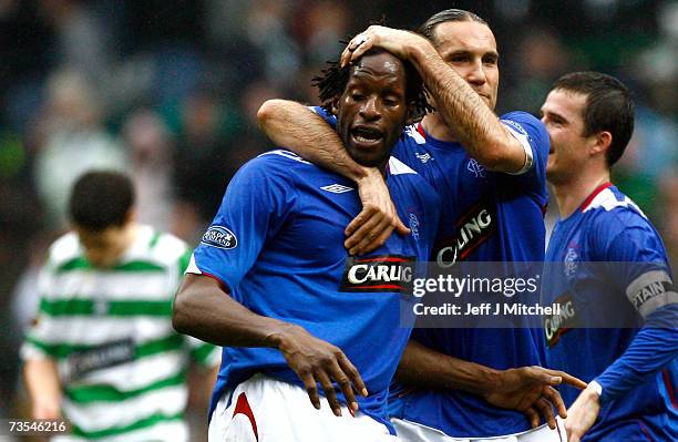 Dado Prso embraces Ugo Ehiogu of Rangers at the end of the Scottish Premier League match between Celtic and Rangers at Celtic Park on March 11 2007...