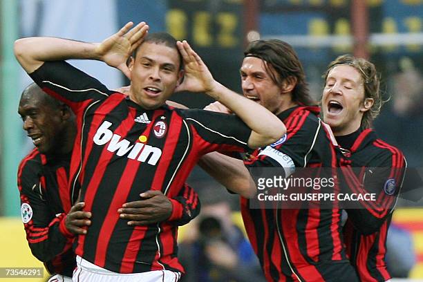 Milan's forward Ronaldo of Brazil celebrates with his teammates after scoring against Inter during their Serie A football match at San Siro Stadium...