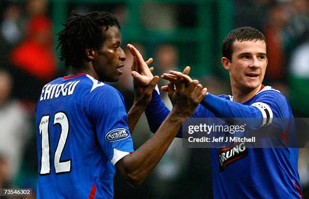 Barry Ferguson congratulates Ugo Ehiogu of Rangers at the end of the Scottish Premier League match between Celtic and Rangers at Celtic Park on March...