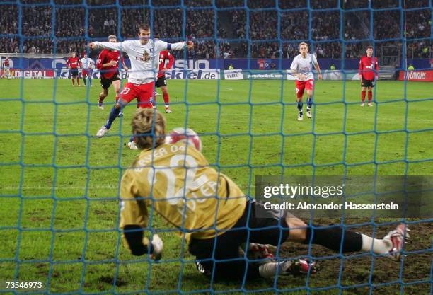 Keeper Rene Adler of Leverkusen saves a penalty shot by Rafael van der Vaart of Hamburg during the Bundesliga match between Hamburger SV and Bayer...