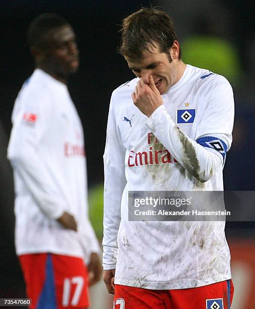 Rafael van der Vaart of Hamburg and his team mate Boubacar Sanogo look dejected after the Bundesliga match between Hamburger SV and Bayer Leverkusen...