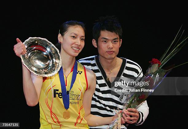 Xie Xingfang of China celebrates with the trophy with boyfriend Dan Li of China after their victory over Pi Hongyan of France in the Women?s Singles...