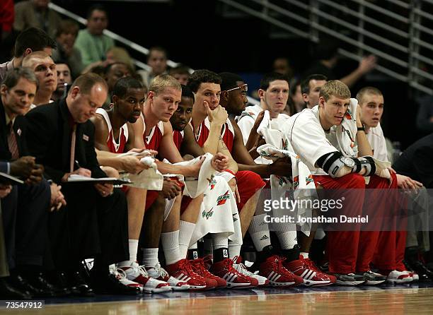 The Wisconsin Badgers bench looks on dejected in the final minutes of their 66-49 loss the Ohio State Buckeyes during the Final of the Big Ten Men's...