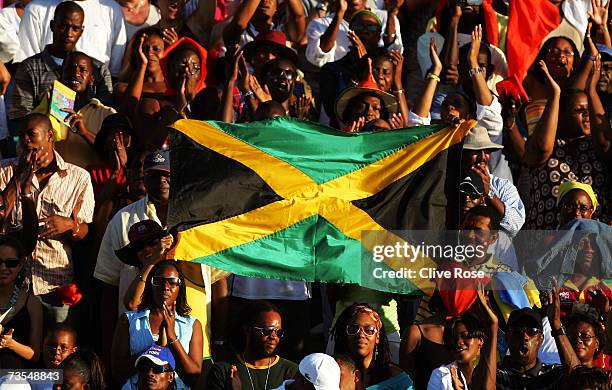 Fans show off the Jamaican flag during the ICC Cricket World Cup 2007 opening ceremony at the Trelawny Multi Purpose Stadium on March 11, 2007 in...