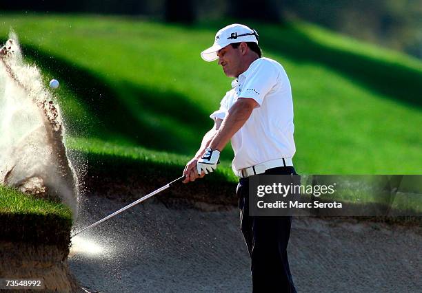 Golfer Zach Johnson hits out of the trap on the 15th fairway during his victory at the PODS Championship on March 11, 2007 at Westin Innisbrook...