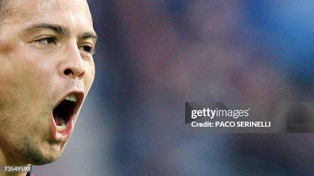 Milan's forward Ronaldo of Brazil celebrates after scoring a goal against Inter Milan during their italian serie A football match at San Siro stadium...