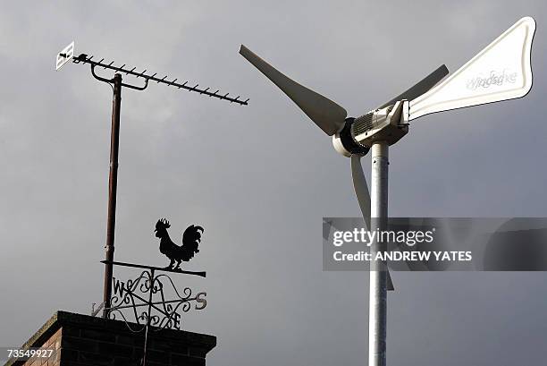 Chester, UNITED KINGDOM: TO GO WITH AFP STORY "AFPLifestyle-Britain-Environment-climate-village" Recent picture of a wind turbine that produces...