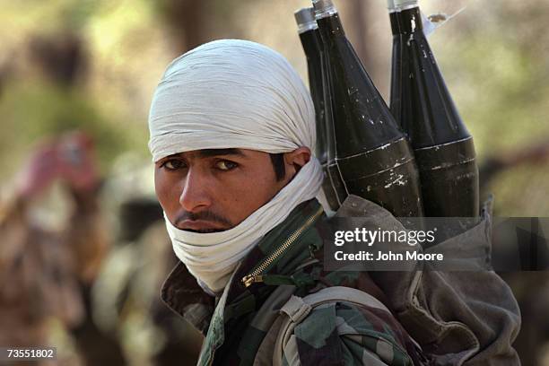 An Afghan Army soldier carrying rocket-propelled grenades arrives with fellow Afghan and UK forces to Kajaki on March 12, 2007 in Southern Helmand...