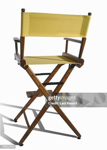 vacant yellow directors chair on white background - directors chair fotografías e imágenes de stock