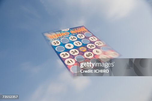 Bingo card floating in cloudy sky Bingo card floating in cloudy sky