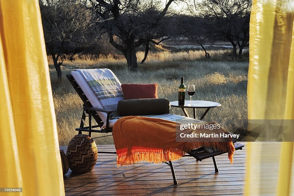 Idyllic Scene of Luxury Deck Chair with Rustic Bushveld Background